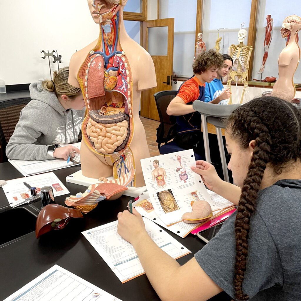 Biology students working in lab.